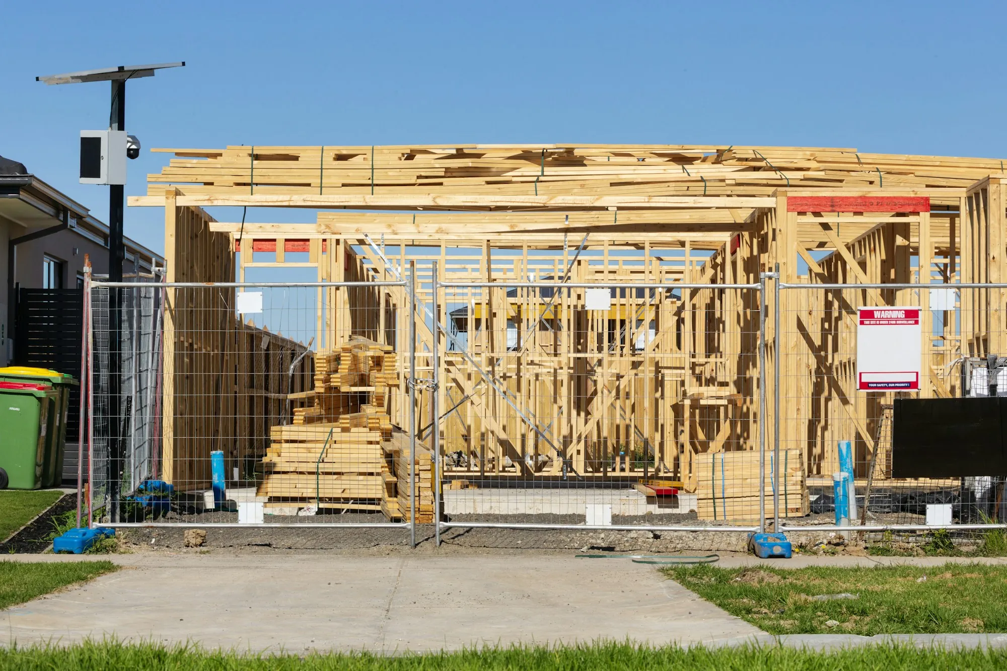 Timber frame of a new house under construction on a clear day