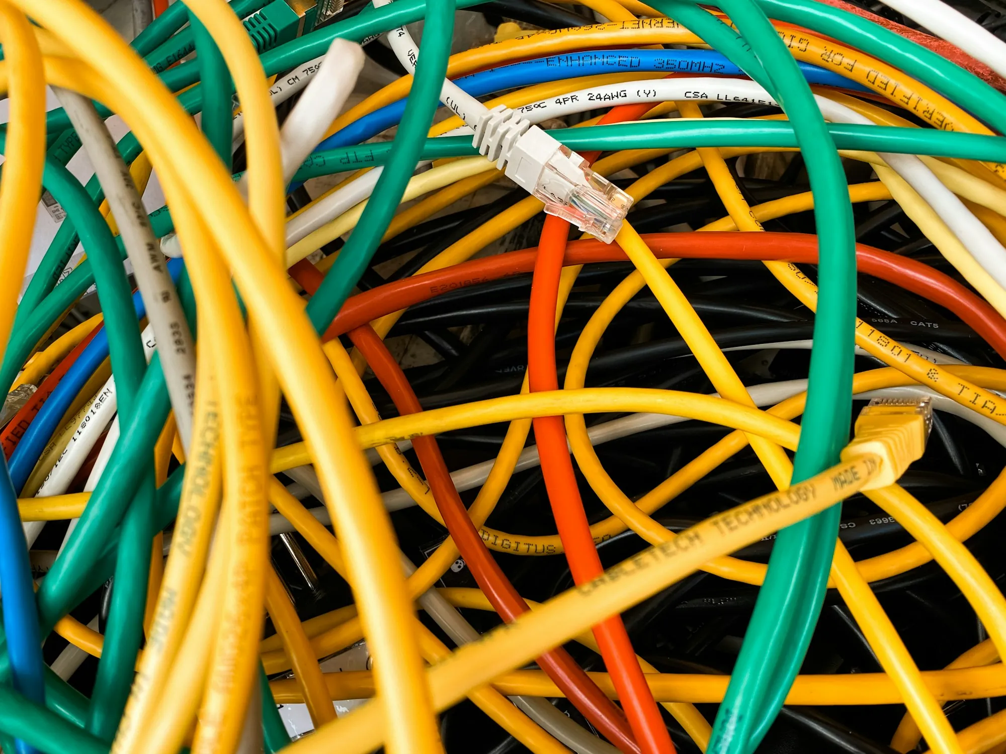 Tangle of colourful electrical cables close up
